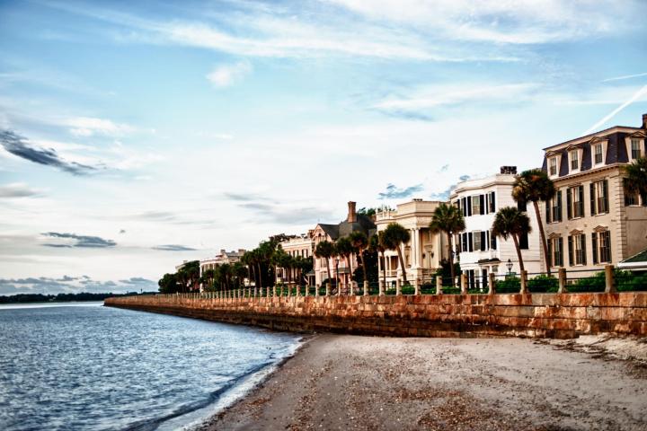 a body of water with a city in the background